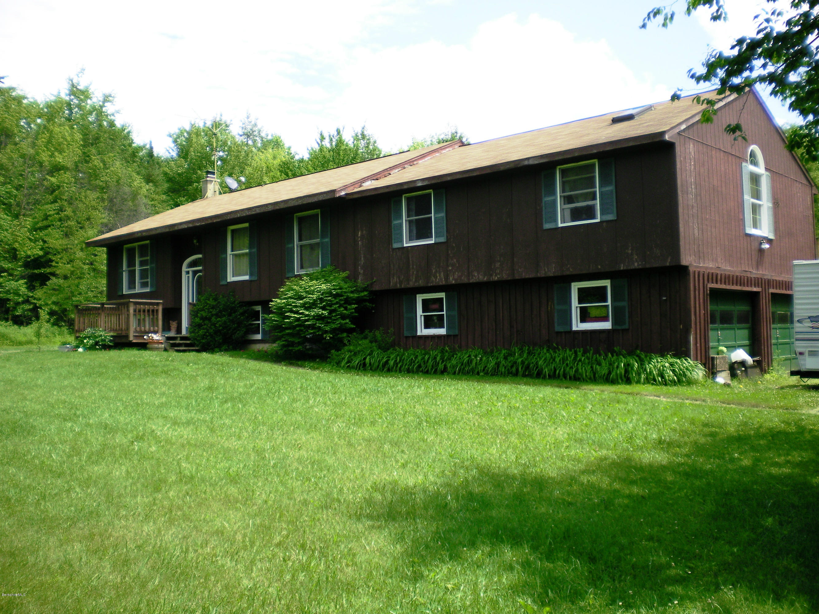 12 Andes Road Peru, MA 01235 - Photo 3 of 32 a brick house with a yard plants and large tree