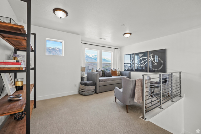 15008 South Springtime Road Draper, UT 84020 - Photo 23 of 37 Living area with light carpet and baseboards