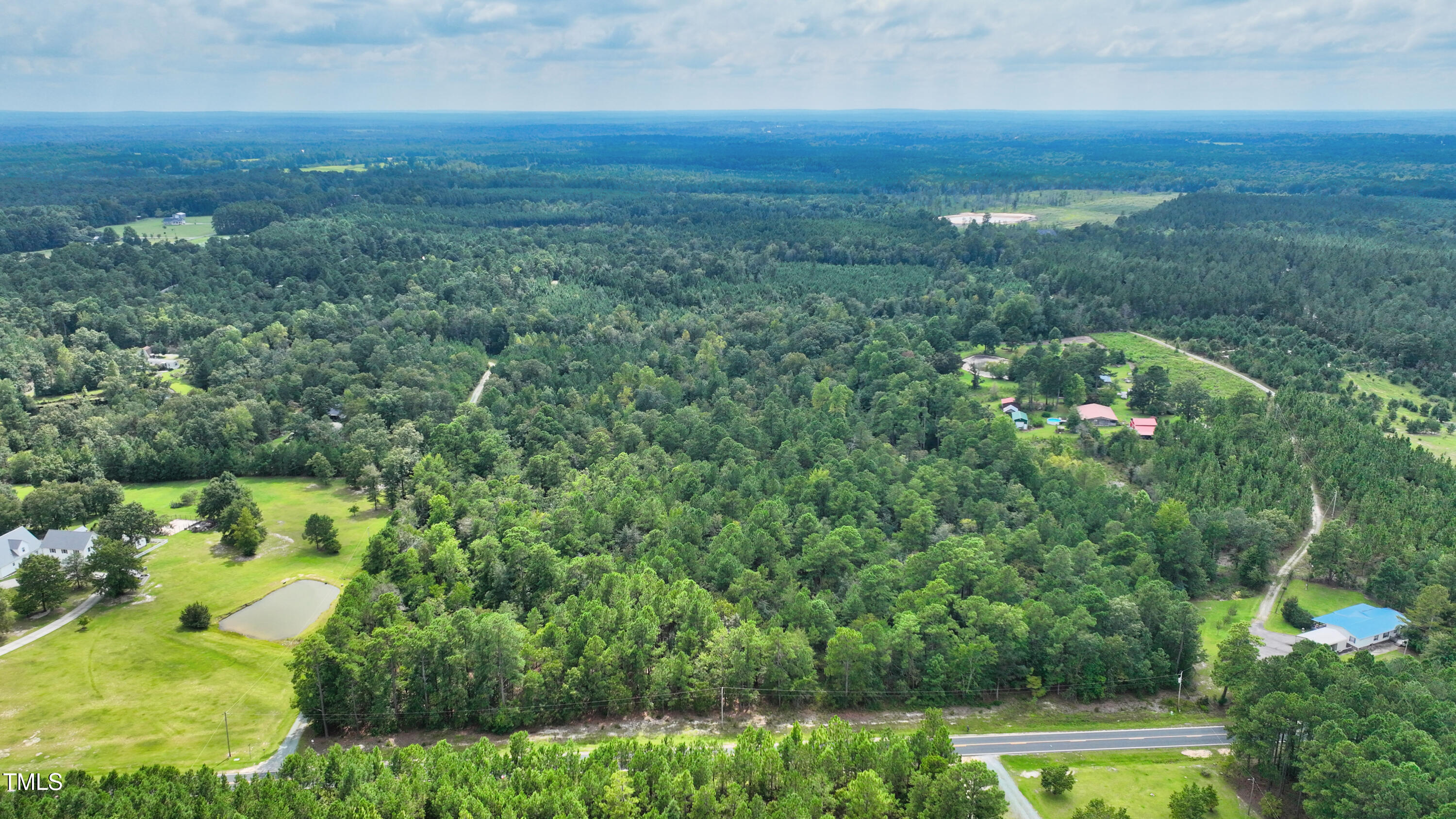 395 Needmore Road Cameron, NC 28326 - Photo 2 of 8 an aerial view of residential houses with outdoor space and trees