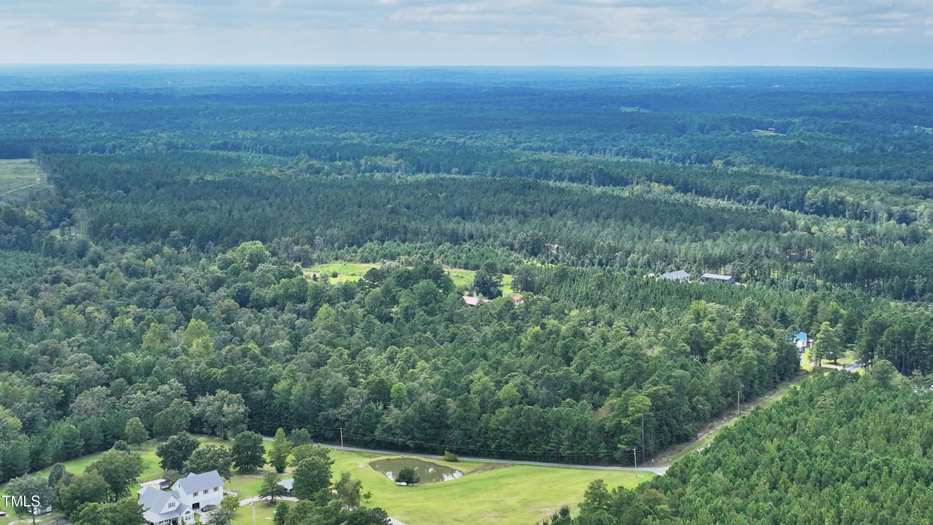 395 Needmore Road Cameron, NC 28326 - Photo 7 of 8 an aerial view of residential houses with outdoor space and trees