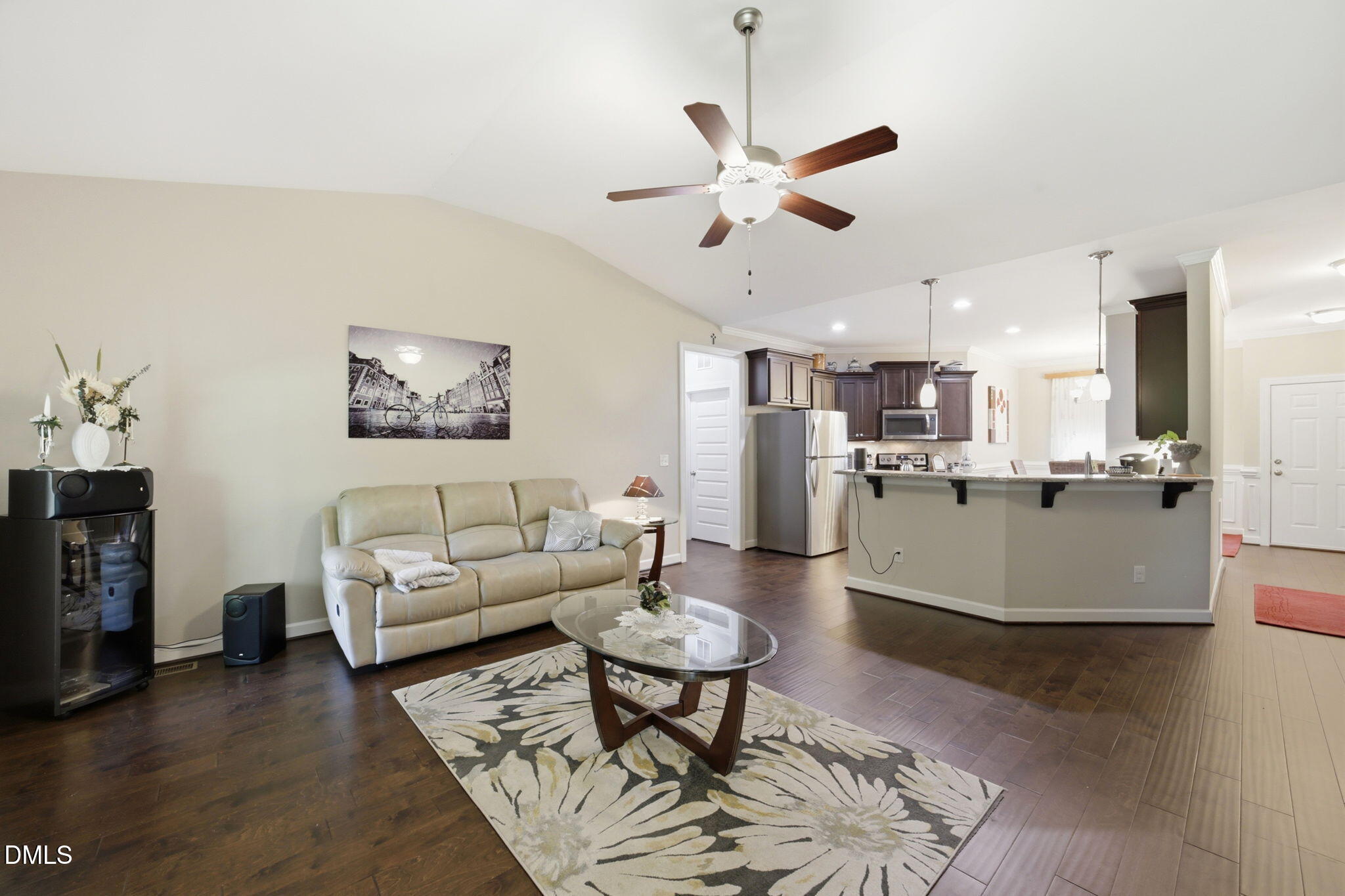 1547 Lassiter Pond Road Four Oaks, NC 27524 - Photo 12 of 45 a living room with furniture kitchen view and a wooden floor