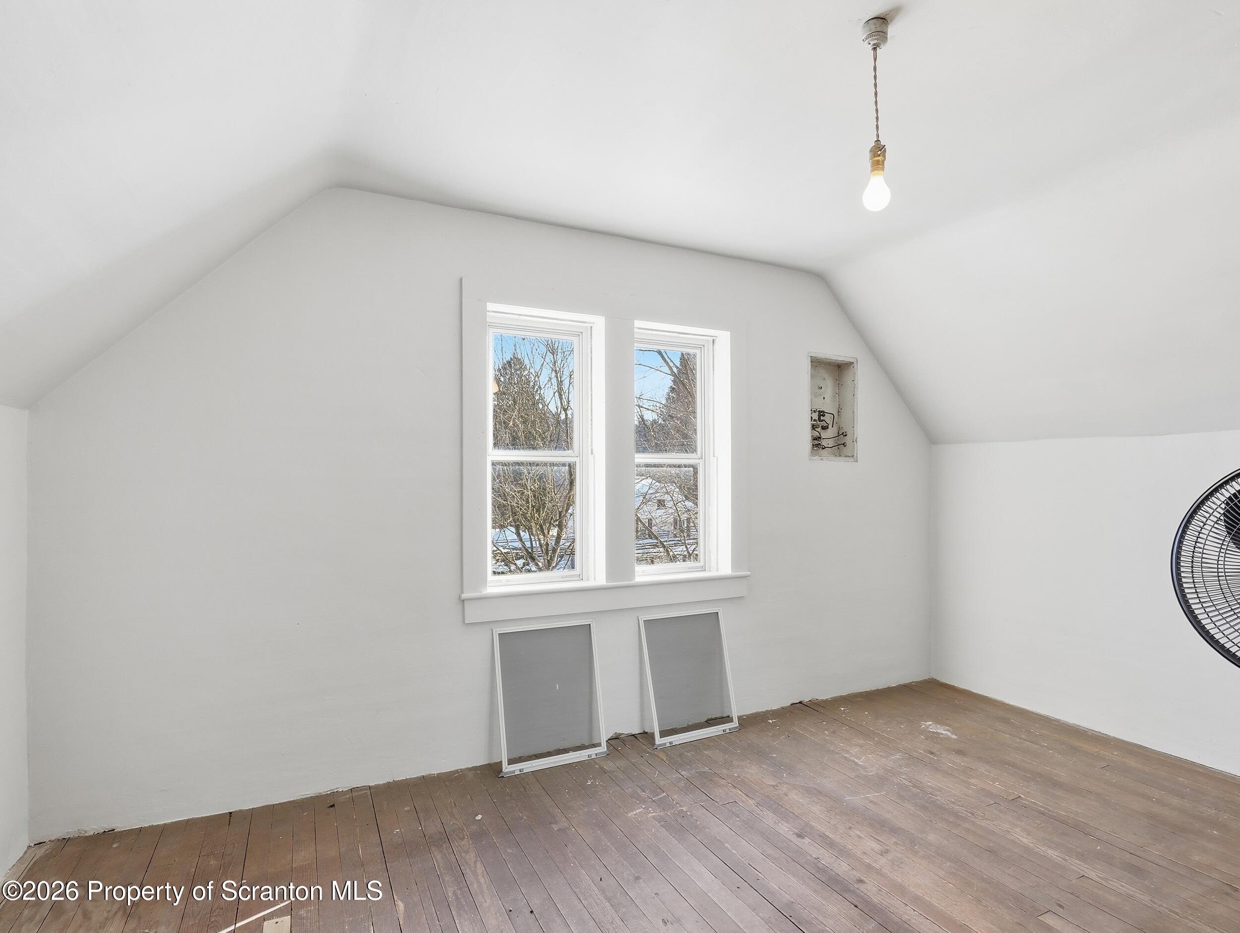 115 State Street Nicholson, PA 18446 - Photo 23 of 29 an empty room with wooden floor and windows