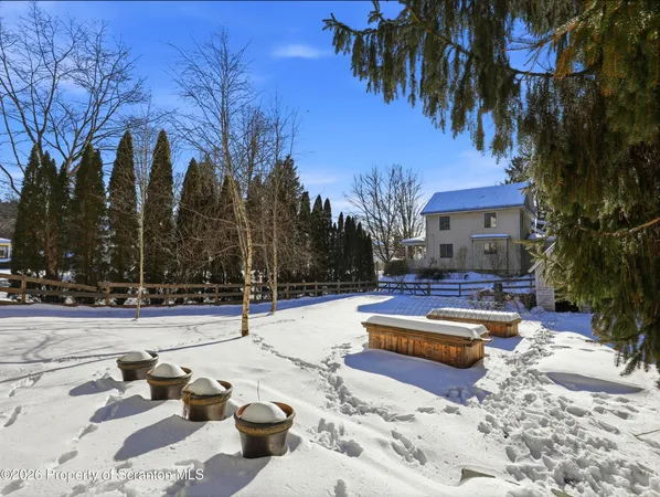 a swimming pool with outdoor seating and yard