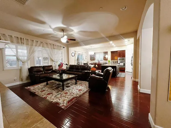 a living room with lots of furniture and a rug
