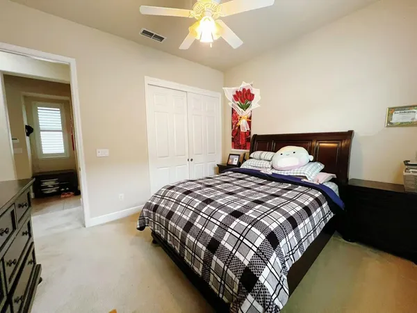 a bedroom with bed and window