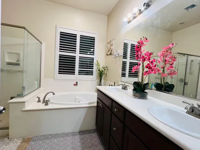 a view of a bathroom with a sink and a mirror