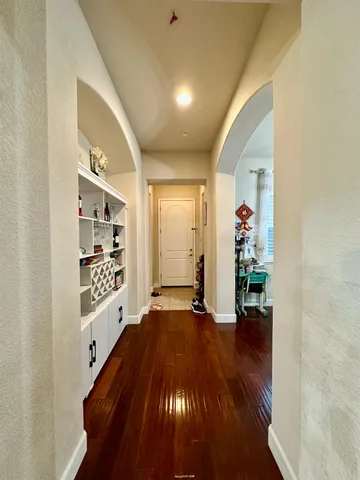 a bathroom with a toilet and a mirror