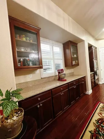 a kitchen with wooden cabinets and a sink