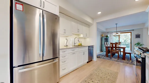 a bathroom with a sink toilet and a mirror