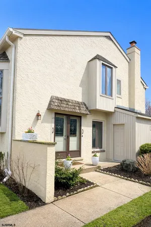a living room with a flat screen tv and a fireplace
