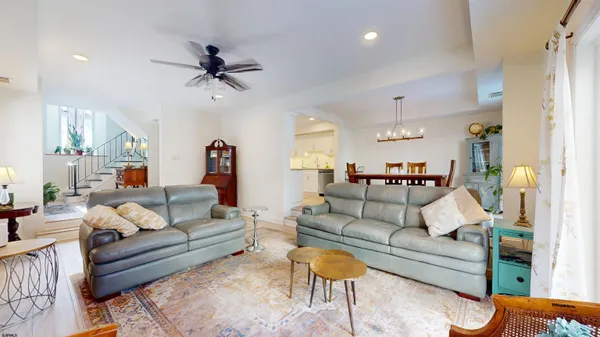 a kitchen with white cabinets and sink