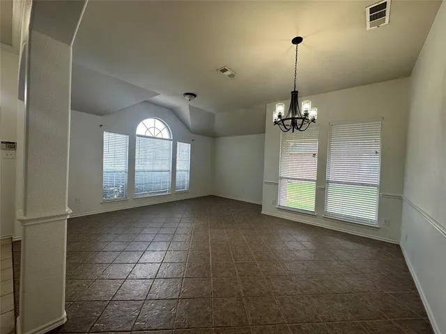 a view of a livingroom with a ceiling fan and window