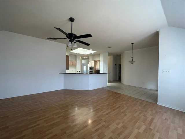 a view of a kitchen with a sink and a window