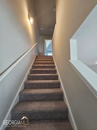 an empty room with a empty space and windows