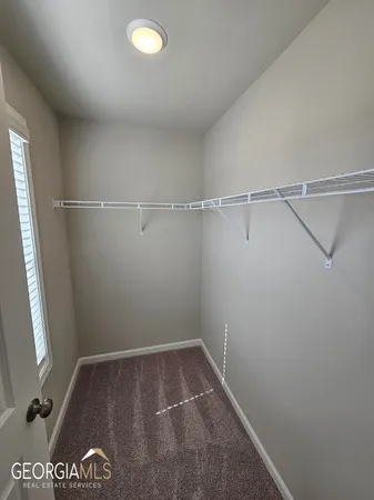 a bathroom with a toilet and a bathtub