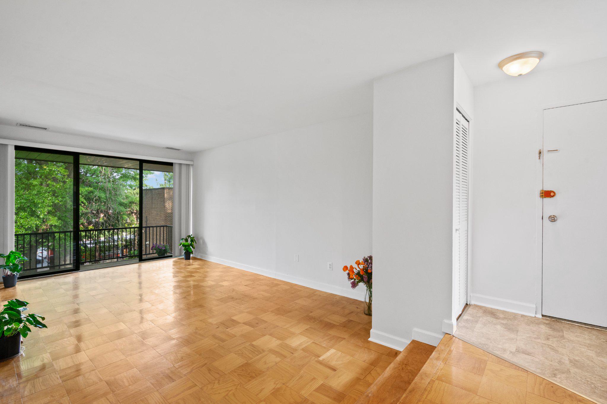 9804 Georgia Avenue, Unit 23302 Silver Spring, MD 20902 - Photo 2 of 24 Spacious, light-filled living area.