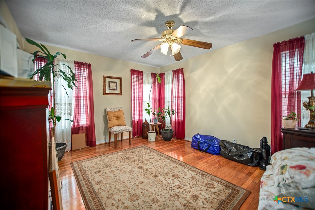218 Burnet Street Port Lavaca, TX 77979 - Photo 15 of 23 a bed room with a bed and a dresser