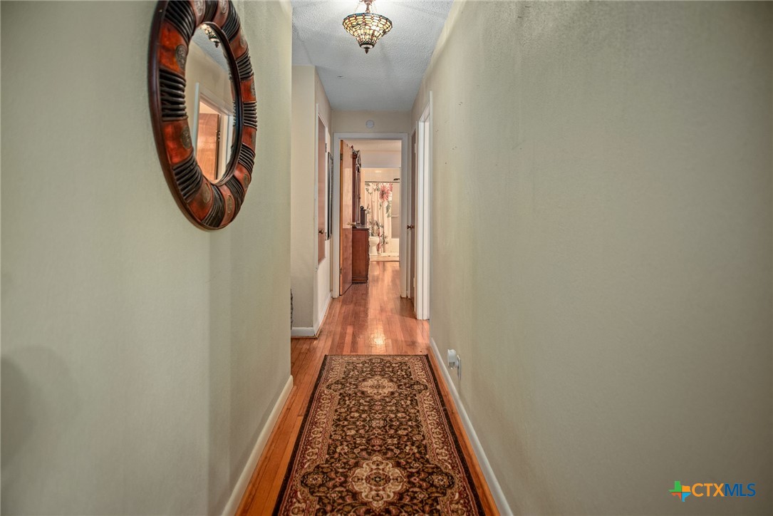 218 Burnet Street Port Lavaca, TX 77979 - Photo 16 of 23 a view of a hallway with washer and dryer