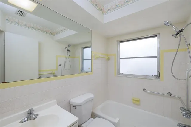 a bathroom with a sink a toilet and a bathtub