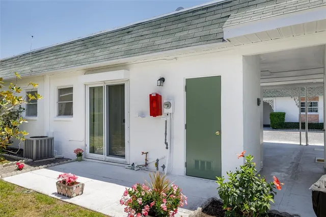 a view of a house with a yard and plants