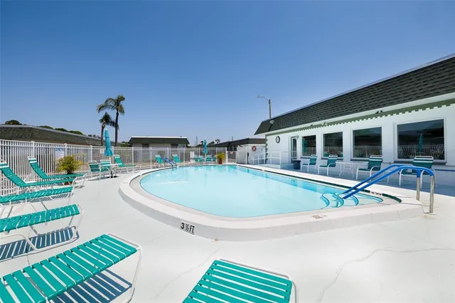 a house view with a swimming pool and outdoor seating