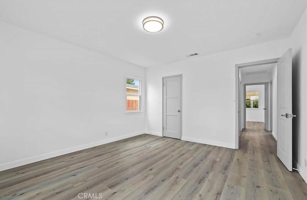 100 Eastern Pasadena, CA 91107 - Photo 14 of 18 a view of an empty room with wooden floor and a window
