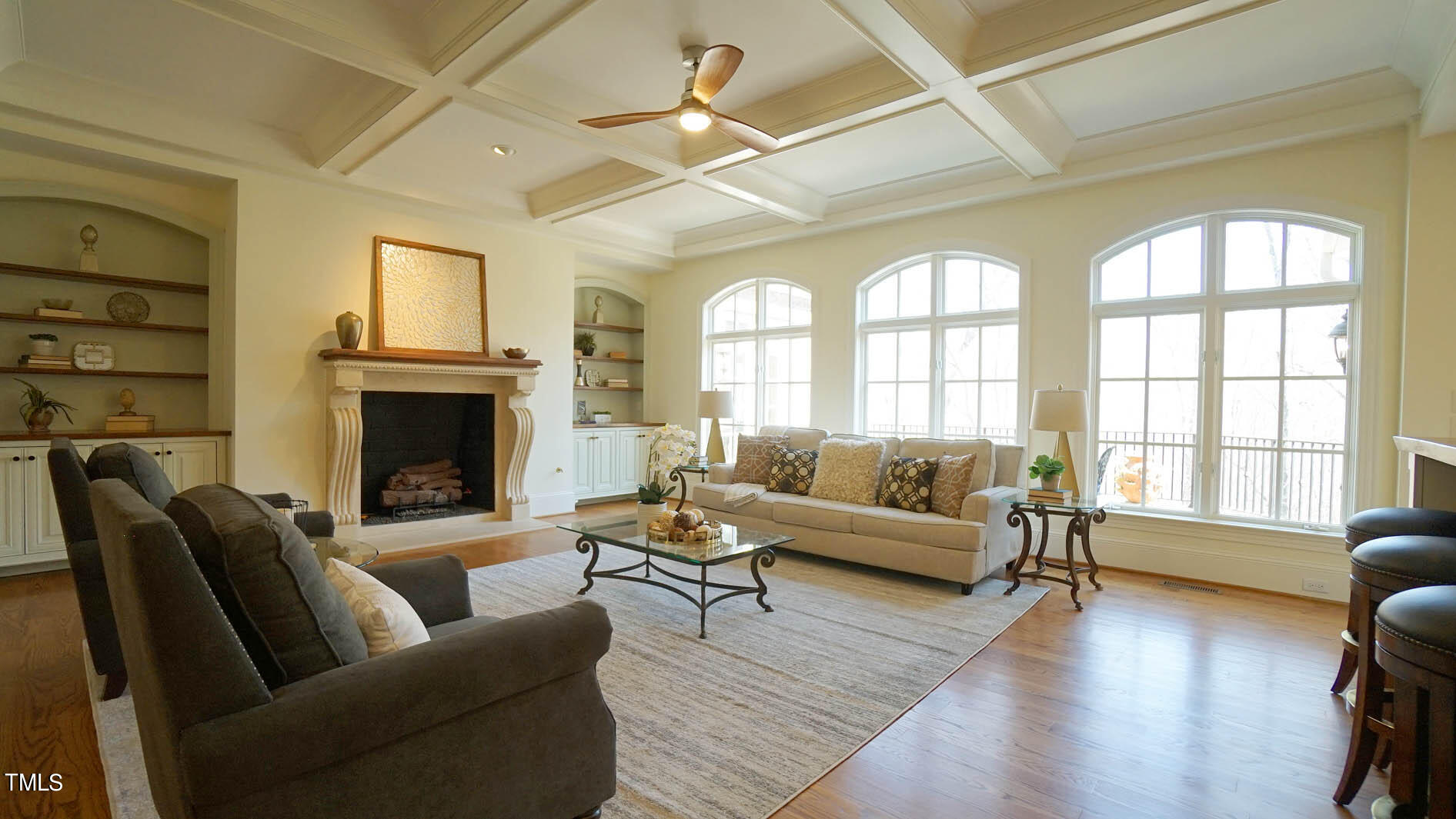 11216 Jonas Ridge Lane Raleigh, NC 27613 - Photo 13 of 75 a living room with furniture a fireplace and a large window