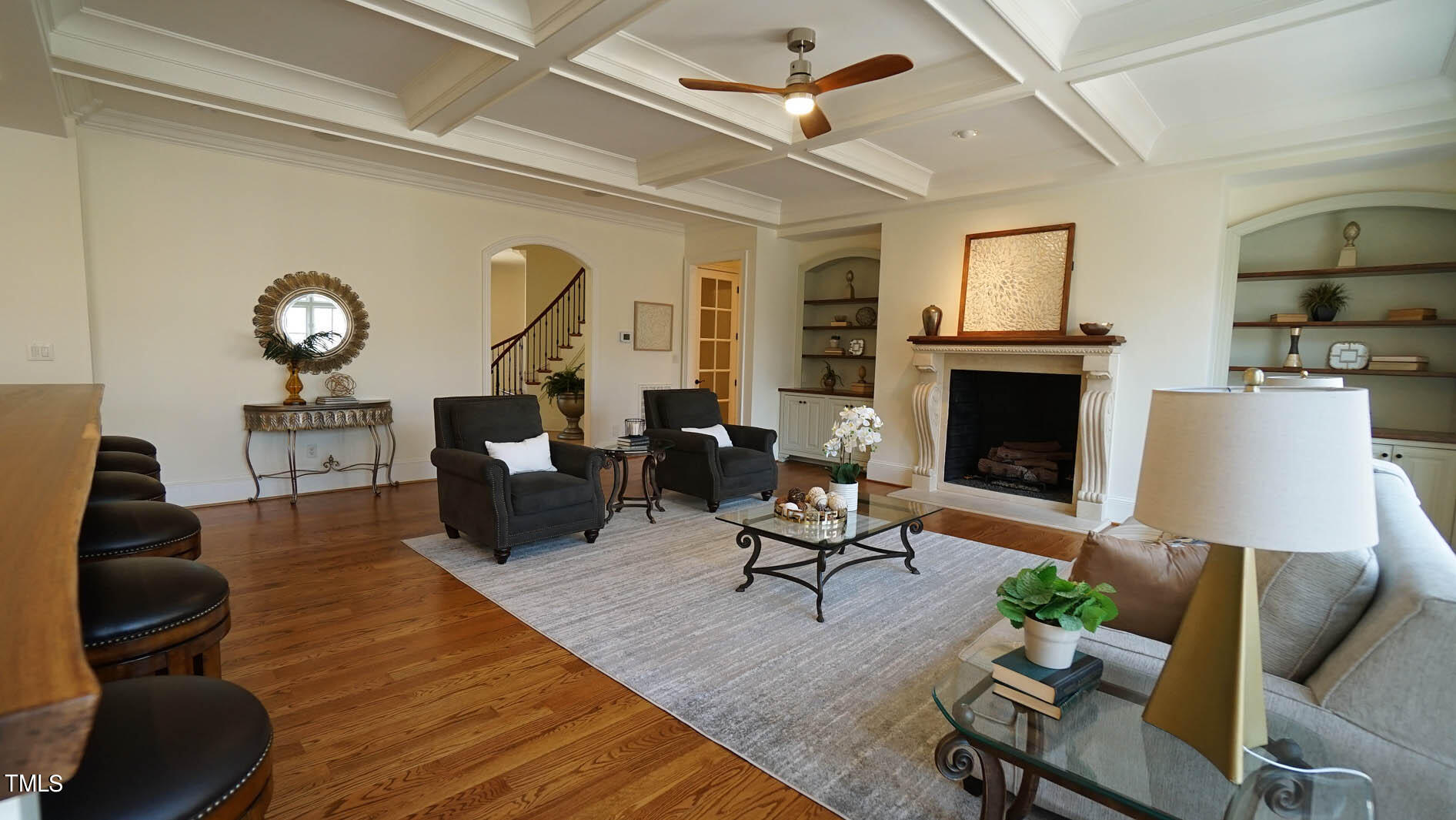 11216 Jonas Ridge Lane Raleigh, NC 27613 - Photo 14 of 75 a living room with furniture a fireplace and a flat screen tv