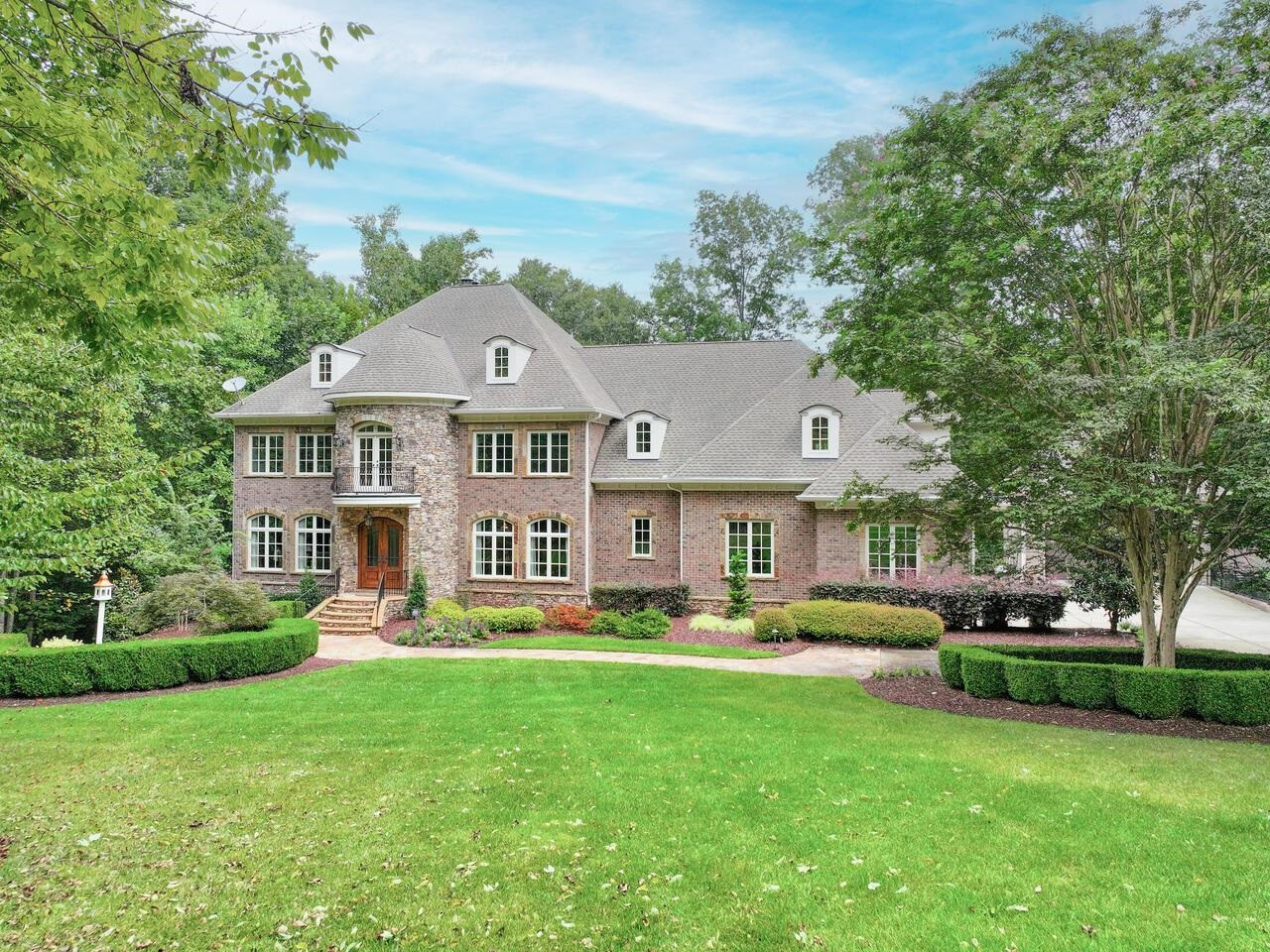 11216 Jonas Ridge Lane Raleigh, NC 27613 - Photo 18 of 75 a front view of a house with a garden and trees