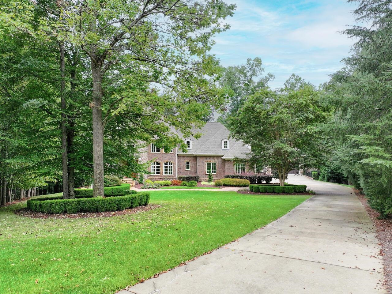 11216 Jonas Ridge Lane Raleigh, NC 27613 - Photo 28 of 75 a view of a house with a big yard plants and large trees