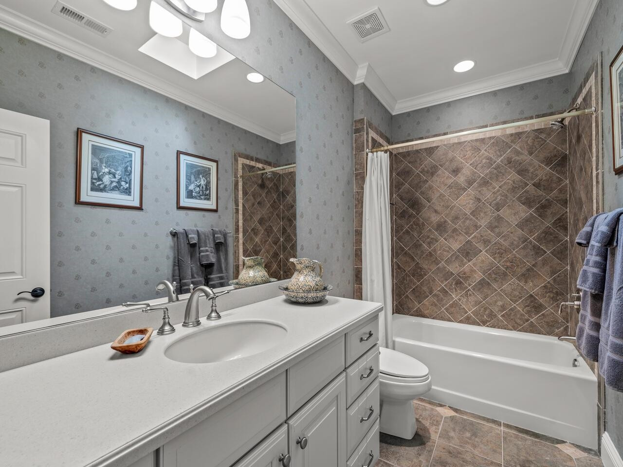 11216 Jonas Ridge Lane Raleigh, NC 27613 - Photo 41 of 75 a bathroom with a sink a toilet and shower