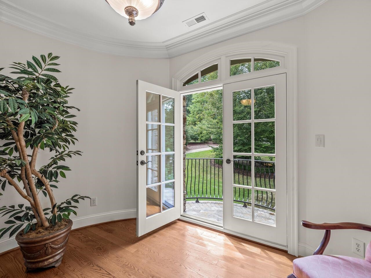 11216 Jonas Ridge Lane Raleigh, NC 27613 - Photo 42 of 75 a view of a livingroom with a potted plant and a window