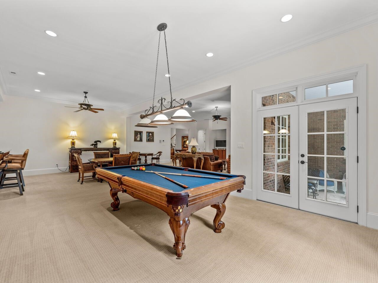 11216 Jonas Ridge Lane Raleigh, NC 27613 - Photo 55 of 75 a room with furniture pool table and flat screen tv