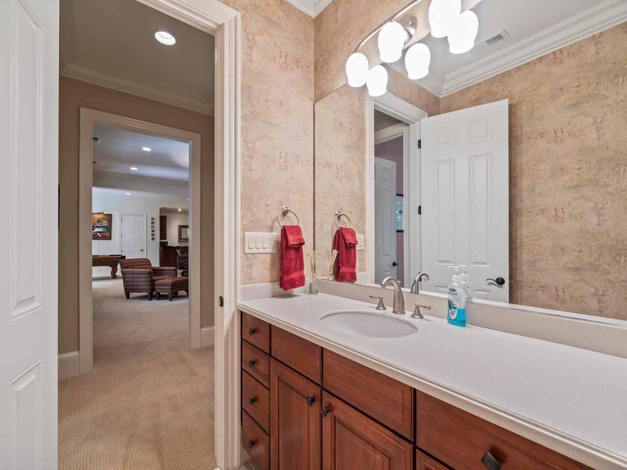 11216 Jonas Ridge Lane Raleigh, NC 27613 - Photo 58 of 75 a bathroom with a sink a vanity and a mirror