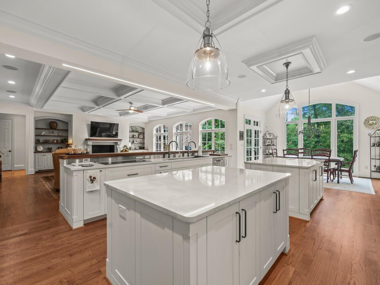 11216 Jonas Ridge Lane Raleigh, NC 27613 - Photo 6 of 75 a kitchen with stainless steel appliances granite countertop a sink stove and wooden floor