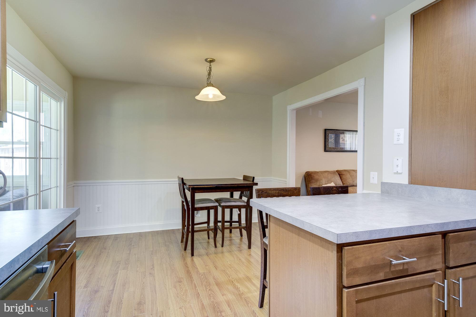 115 Applecreek Road Frederick, MD 21702 - Photo 14 of 33 Space for a large table in the dining room.