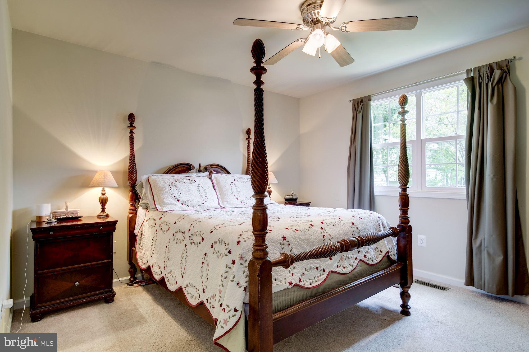 Master bedroom with ceiling fan.