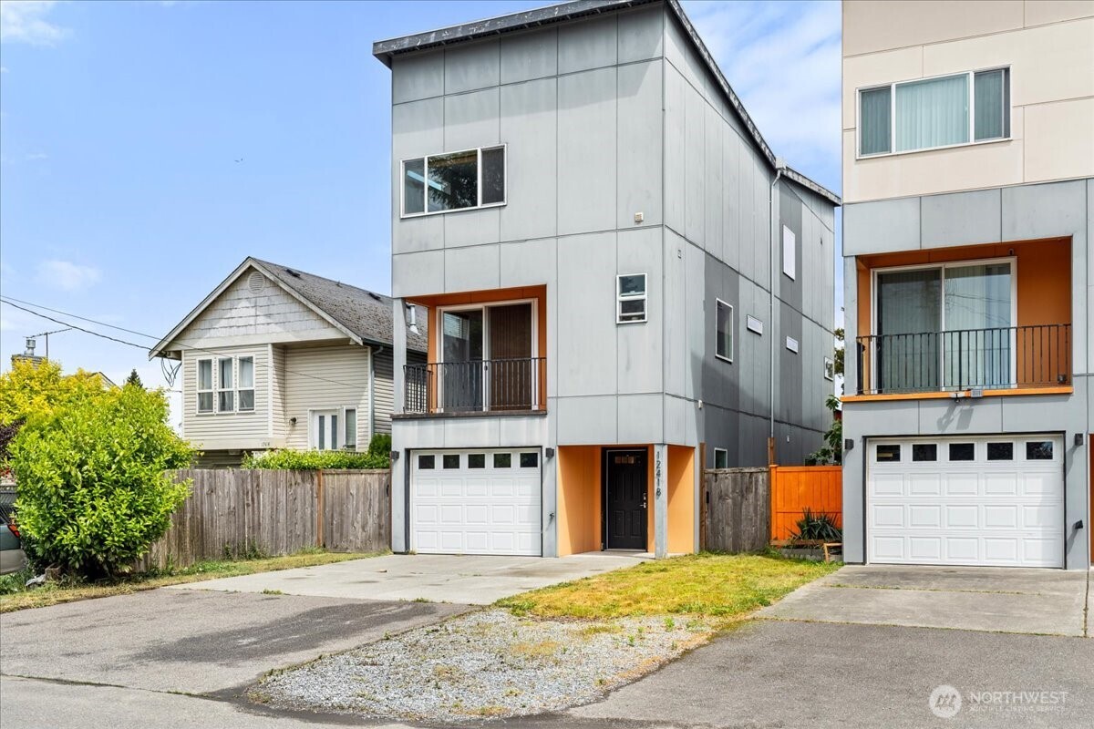 12418 2nd Place Southwest Burien, WA 98146 - Photo 1 of 39 a view of a house with a roof deck