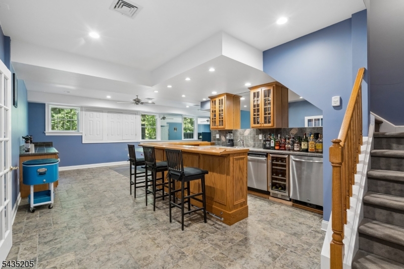 12 Oak Hill Road Bernards, NJ 07920 - Photo 22 of 33 a kitchen with kitchen island granite countertop wooden cabinets and stainless steel appliances