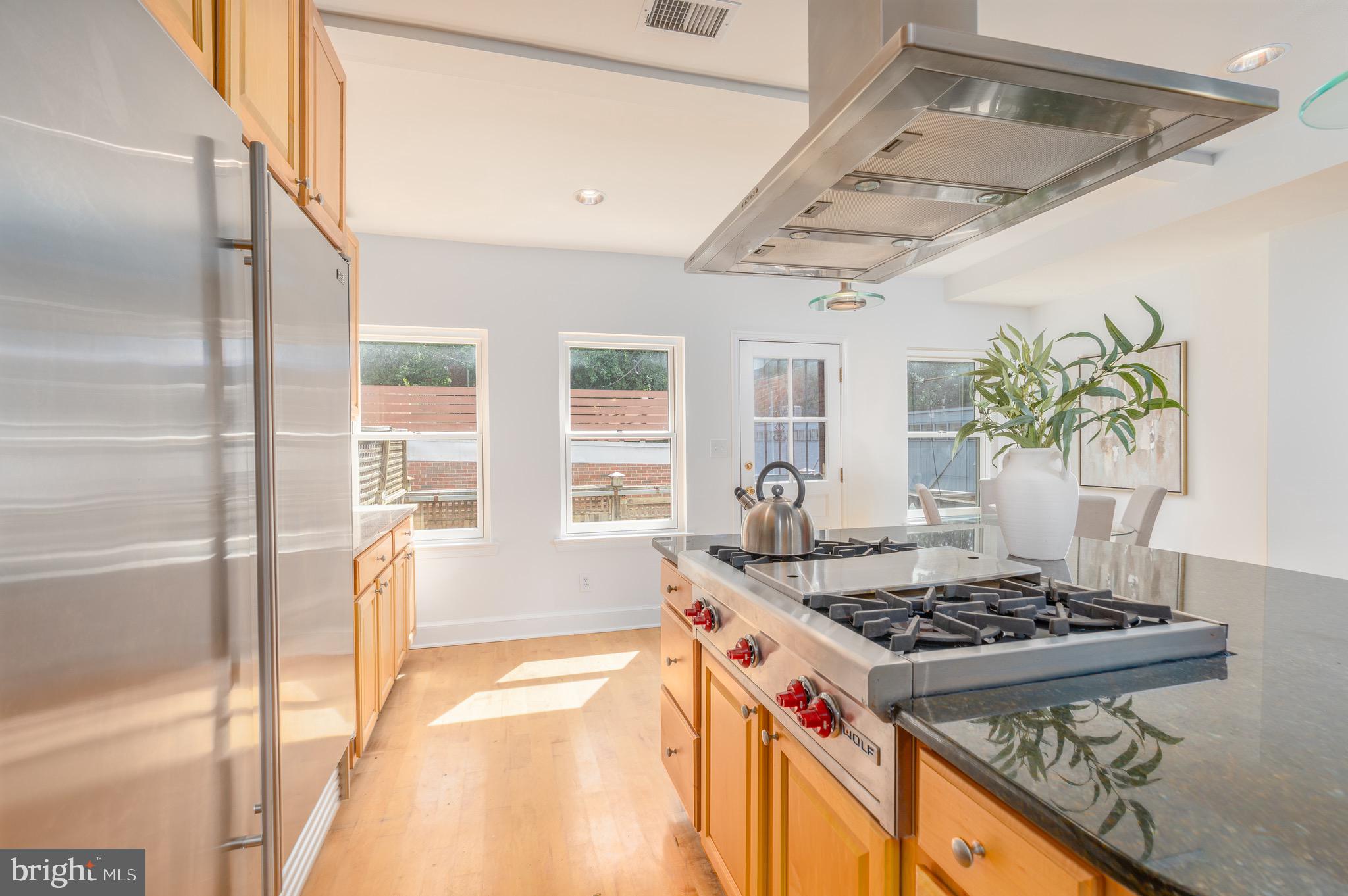 1683 35th Street Northwest, Unit A Washington, DC 20007 - Photo 12 of 26 a kitchen with a stove and a shower