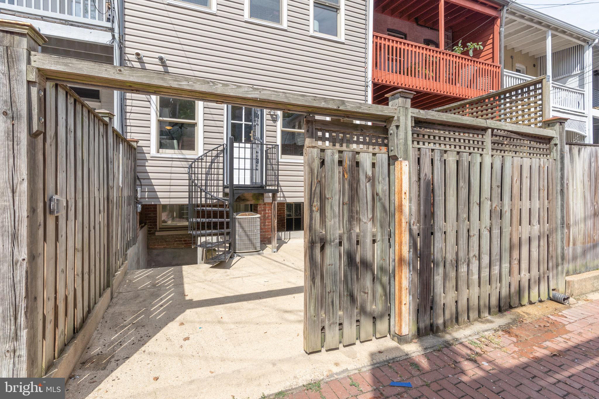 1683 35th Street Northwest, Unit A Washington, DC 20007 - Photo 15 of 26 a view of a house with backyard and sitting area