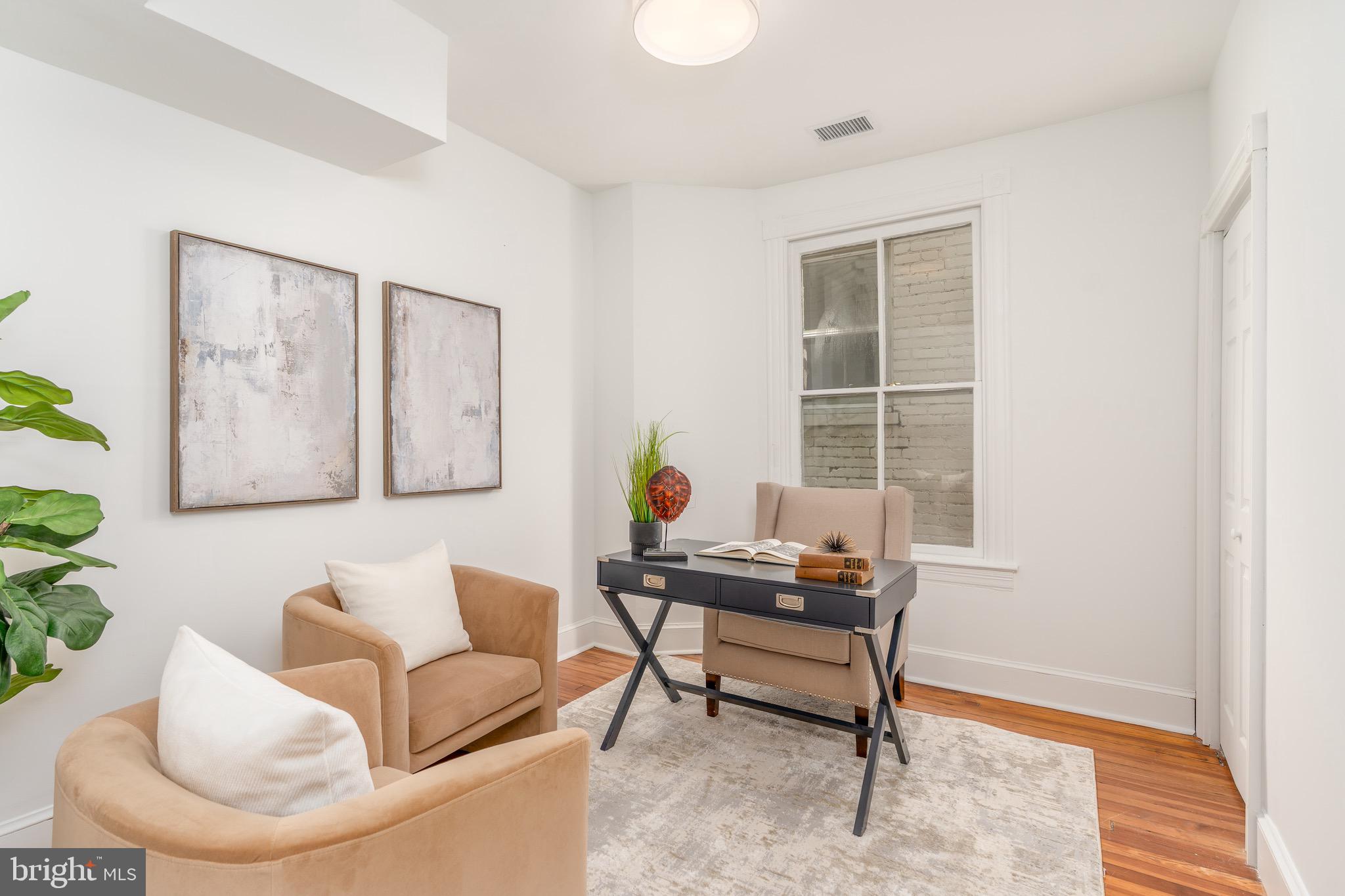 1683 35th Street Northwest, Unit A Washington, DC 20007 - Photo 22 of 26 a living room with furniture and a window