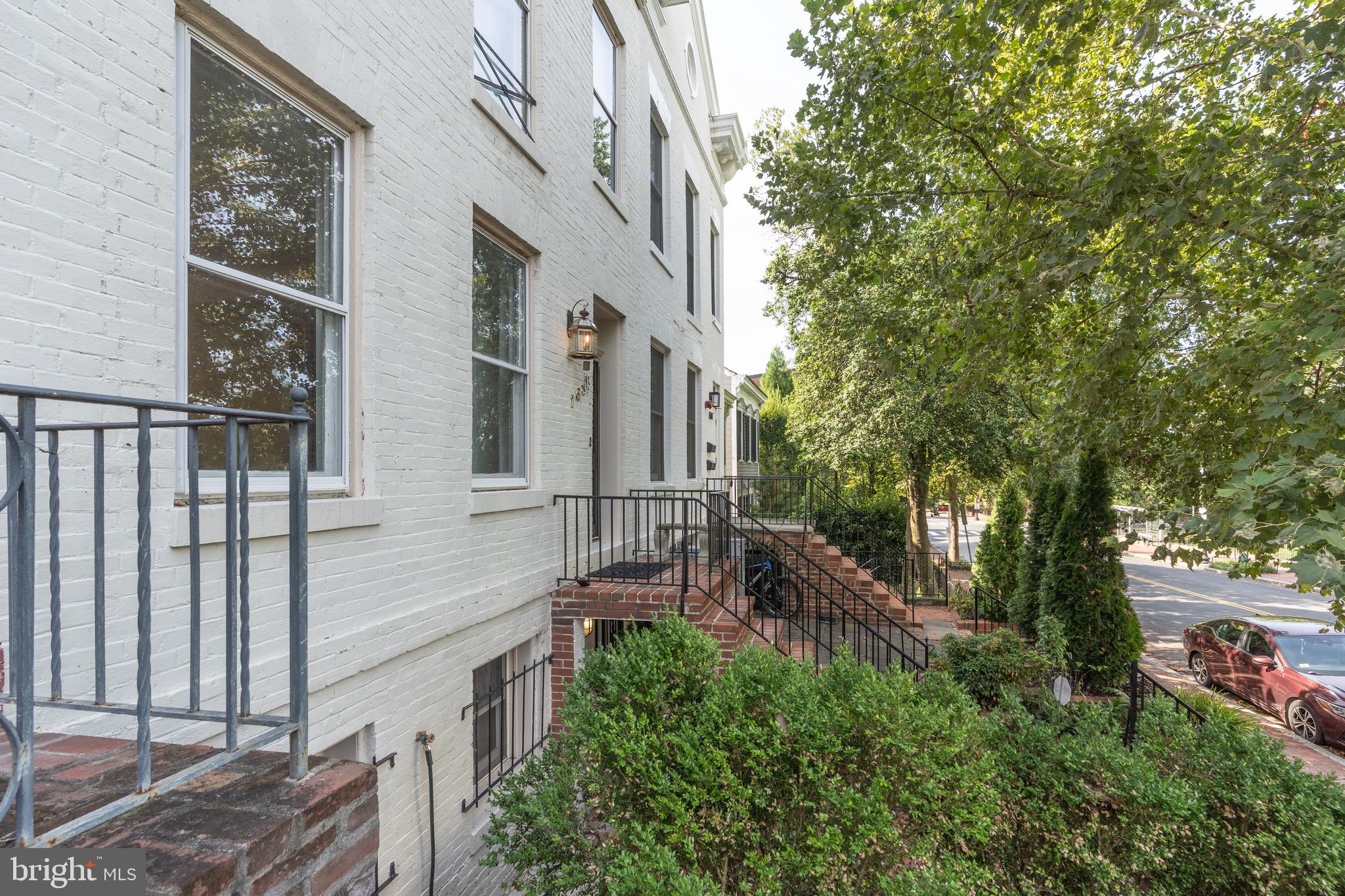1683 35th Street Northwest, Unit A Washington, DC 20007 - Photo 26 of 26 a view of a house with a tree beside it