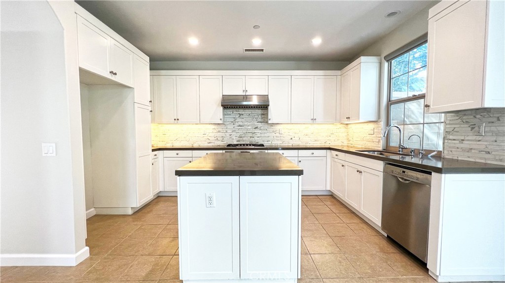 133 Copeland Irvine, CA 92618 - Photo 6 of 18 a kitchen with stainless steel appliances granite countertop a refrigerator and a stove