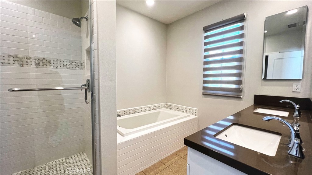 133 Copeland Irvine, CA 92618 - Photo 10 of 18 a bathroom with a tub sink and shower