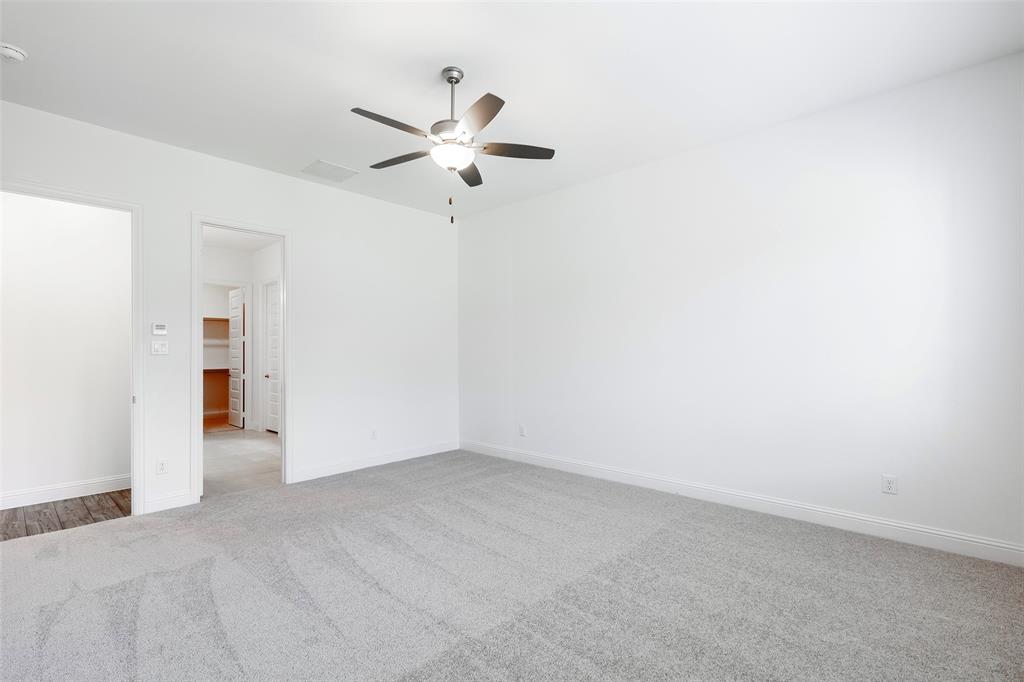 3207 Malcolm Road Melissa, TX 75454 - Photo 21 of 40 an empty room with a ceiling fan and window