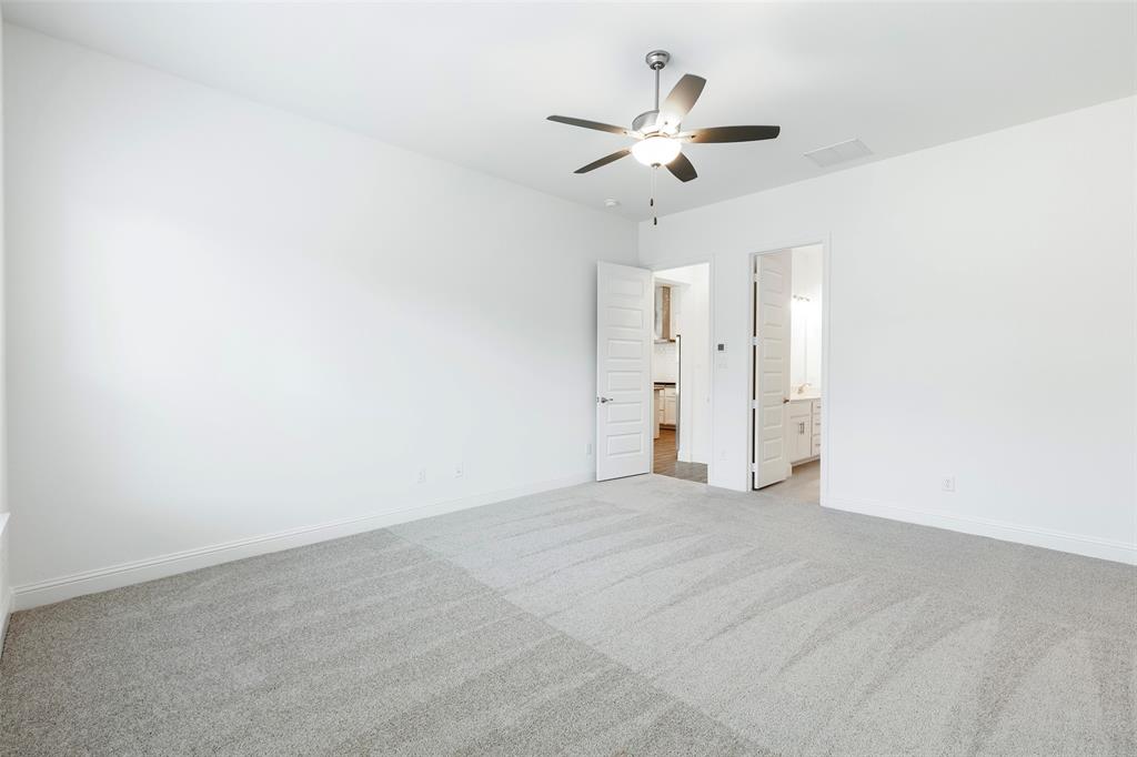 3207 Malcolm Road Melissa, TX 75454 - Photo 22 of 40 a view of an empty room with a chandelier fan