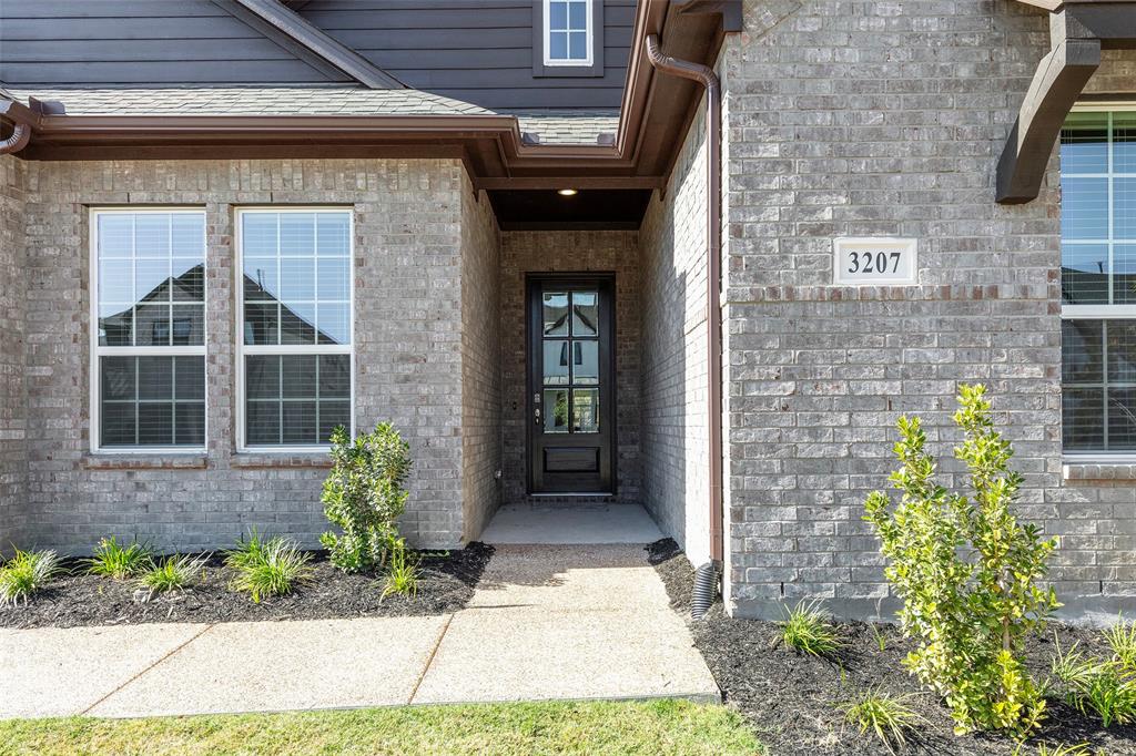 3207 Malcolm Road Melissa, TX 75454 - Photo 4 of 40 a front view of a brick house with a large windows