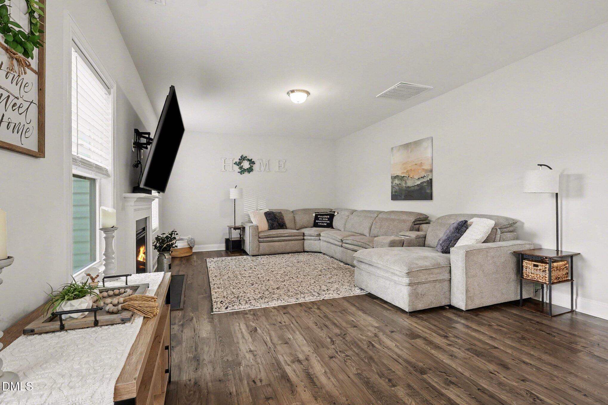 190 Stephens Timberline View Clayton, NC 27520 - Photo 12 of 42 a living room with furniture and a flat screen tv