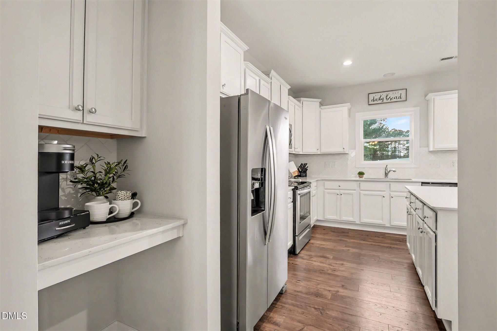 190 Stephens Timberline View Clayton, NC 27520 - Photo 19 of 42 a kitchen with white cabinets and white appliances